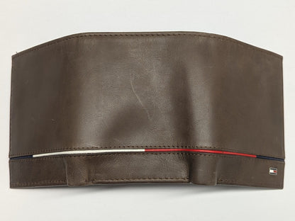 Brown leather wallet with visible brand logo on a light gray background
