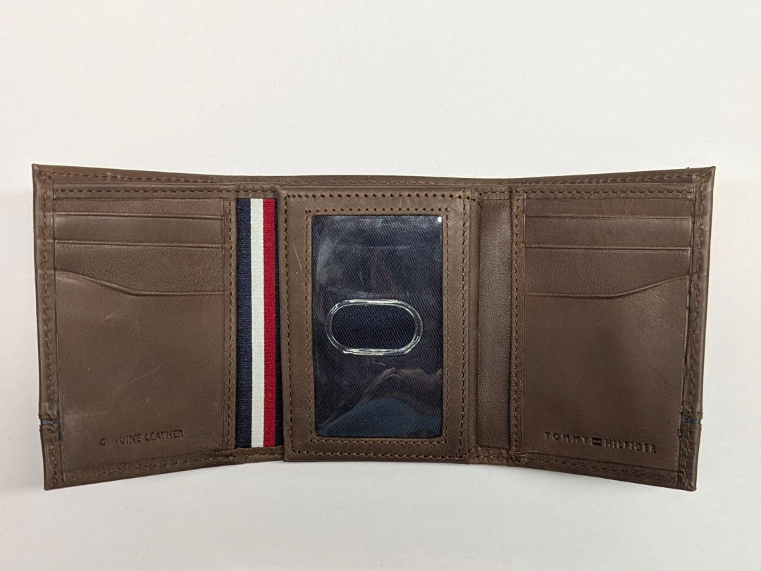 Brown leather wallet with a visible brand logo on a white background