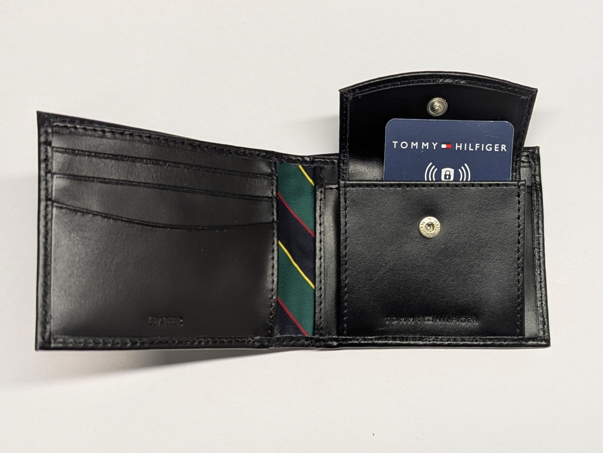 Black leather wallet with card slots on a white background