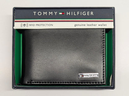 Tommy Hilfiger black leather wallet in packaging on a light gray background