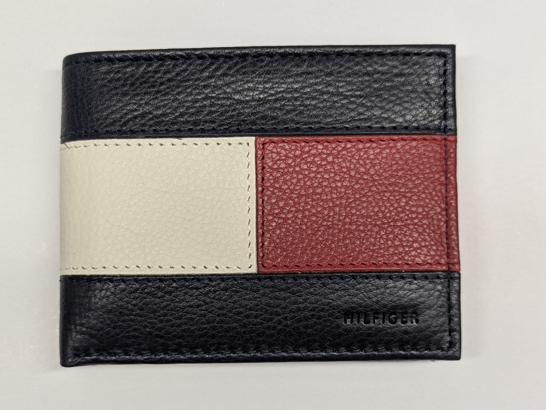 Multicolored leather wallet with 'Tommy Hilfiger' branding on a light gray background