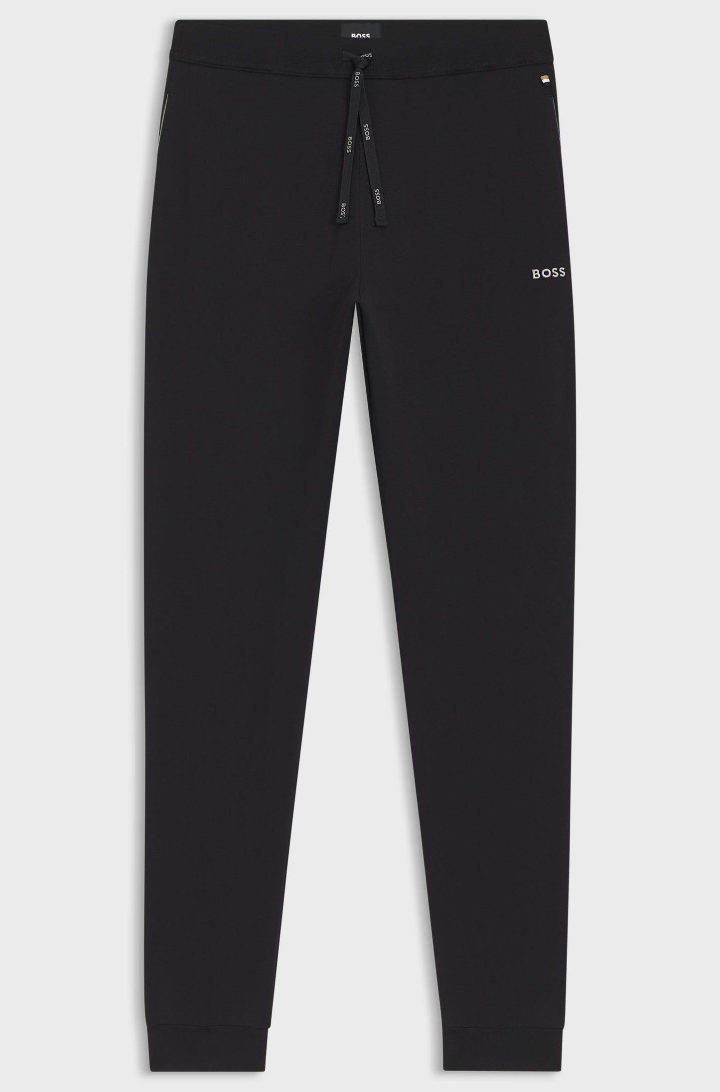 Black pants with a brand logo on a light gray background