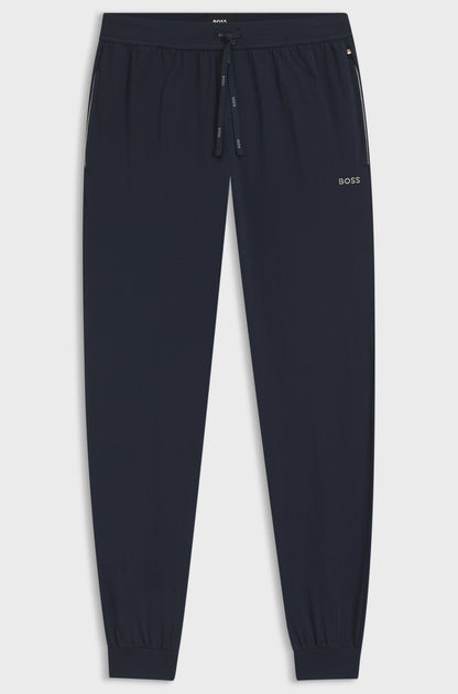Navy blue jogger pants with a brand logo on a light gray background