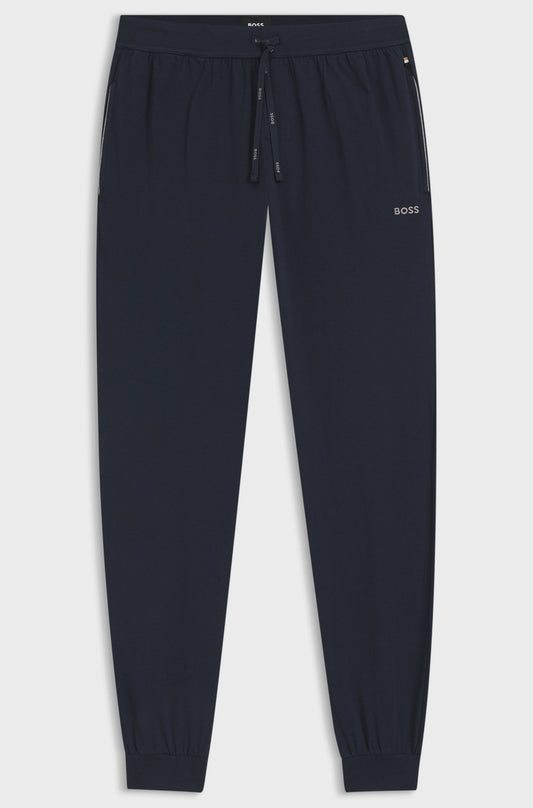 Navy blue jogger pants with a brand logo on a light gray background
